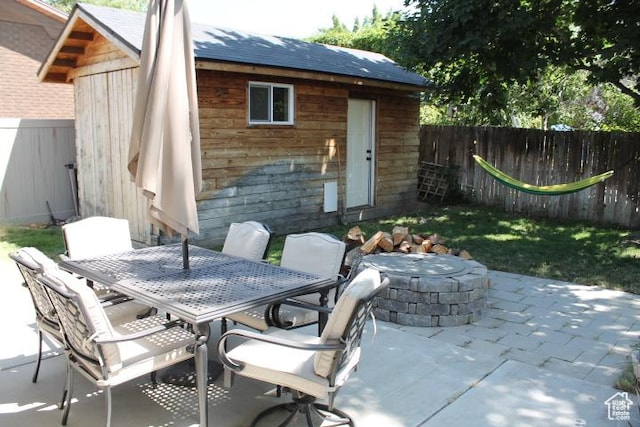 1268 E Edenbrook Dr, Sandy, UT 84094 - fenced backyard featuring a patio, an outdoor fire pit, an outdoor structure, and outdoor dining area