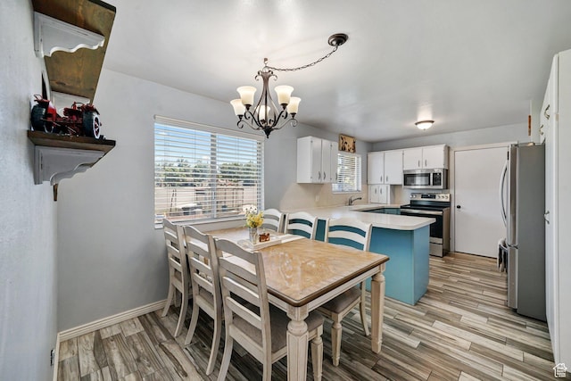 451 S 200 E, Heber City, UT 84032 - dining area featuring a chandelier and light wood-style floors
