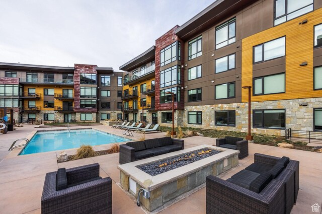 2431 W High Mountain Rd Unit 504, Park City, UT 84098 - community pool with a fire pit and a patio area