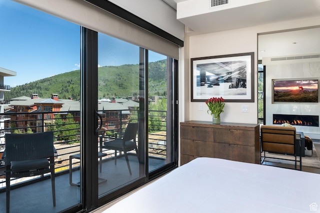 2431 W High Mountain Rd Unit 504, Park City, UT 84098 - bedroom with a mountain view and a warm lit fireplace