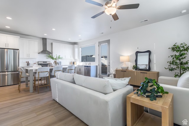 2719 N 2775 W Unit 120, Plain City, UT 84404 - living area featuring a ceiling fan, light wood-type flooring, and recessed lighting