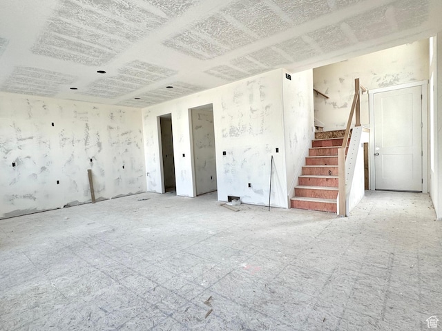 2719 N 2775 W Unit 120, Plain City, UT 84404 - unfurnished living room with stairway
