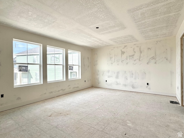 2719 N 2775 W Unit 120, Plain City, UT 84404 - spare room with a textured ceiling and baseboards