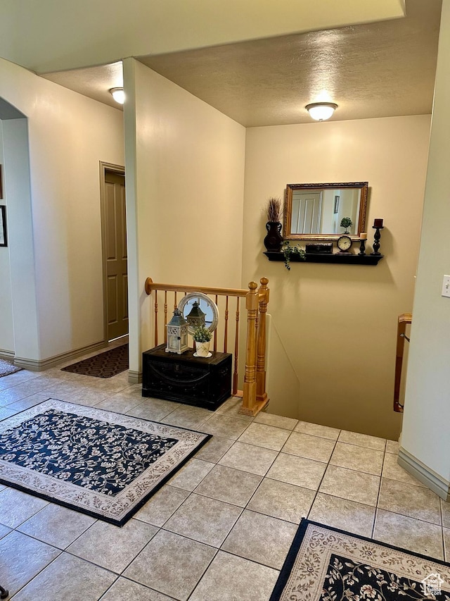 12413 S Andreas St W, Riverton, UT 84065 - corridor featuring an upstairs landing, tile patterned floors, and a textured ceiling