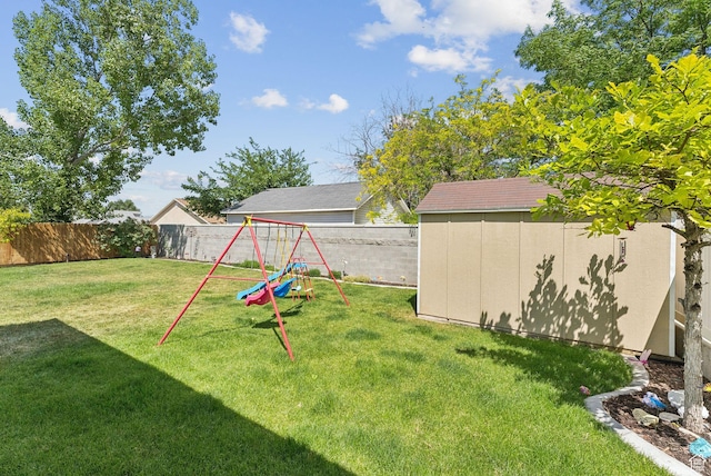 3573 S Deann Dr W, West Valley City, UT 84128 - fenced backyard featuring a storage shed and a playground