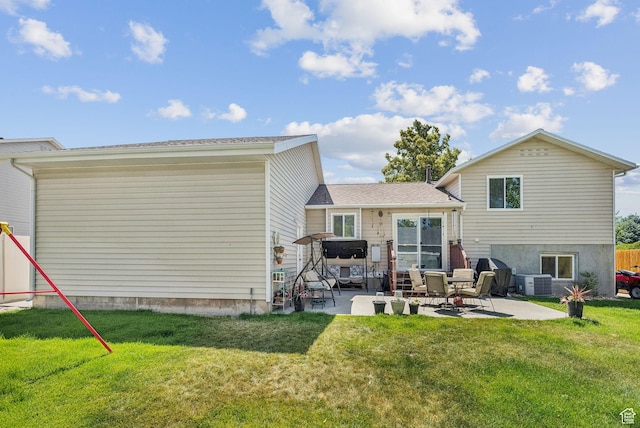 3573 S Deann Dr W, West Valley City, UT 84128 - back of property with a patio and a yard