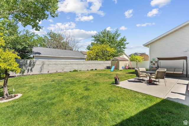 3573 S Deann Dr W, West Valley City, UT 84128 - fenced backyard with a playground and a patio area