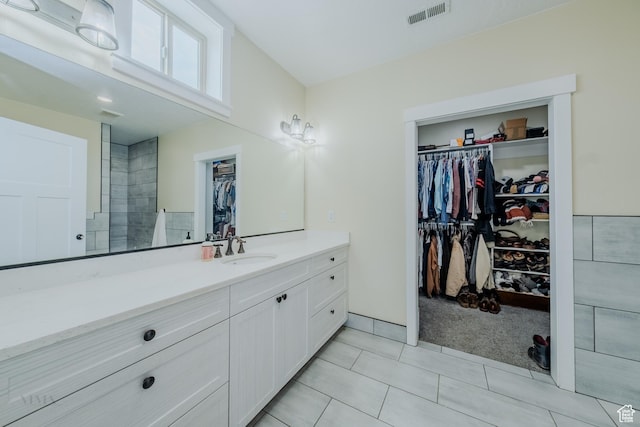 7395 N Johnson Canyon Rd, Kanab, UT 84741 - bathroom with vanity, a walk in closet, and tile patterned flooring