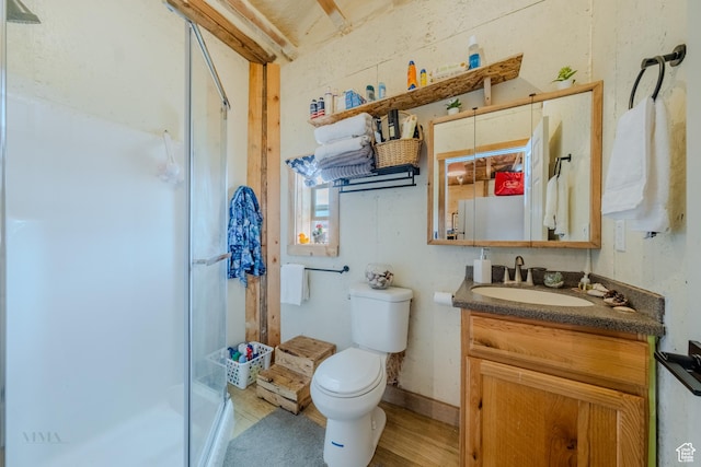 7395 N Johnson Canyon Rd, Kanab, UT 84741 - bathroom featuring a shower stall, vanity, and wood finished floors