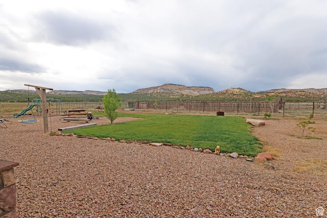 7395 N Johnson Canyon Rd, Kanab, UT 84741 - view of yard featuring a playground and a mountain view