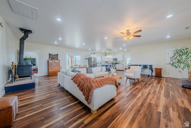 7395 N Johnson Canyon Rd, Kanab, UT 84741 - living area featuring wood finished floors, ceiling fan, a wood stove, and recessed lighting