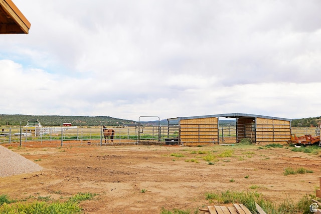 7395 N Johnson Canyon Rd, Kanab, UT 84741 - view of yard with an exterior structure, a rural view, and an outdoor structure