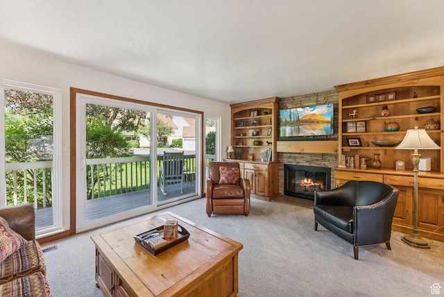 171 Dunlop Ct, Park City, UT 84060 - living room with light colored carpet, a fireplace, and built in shelves