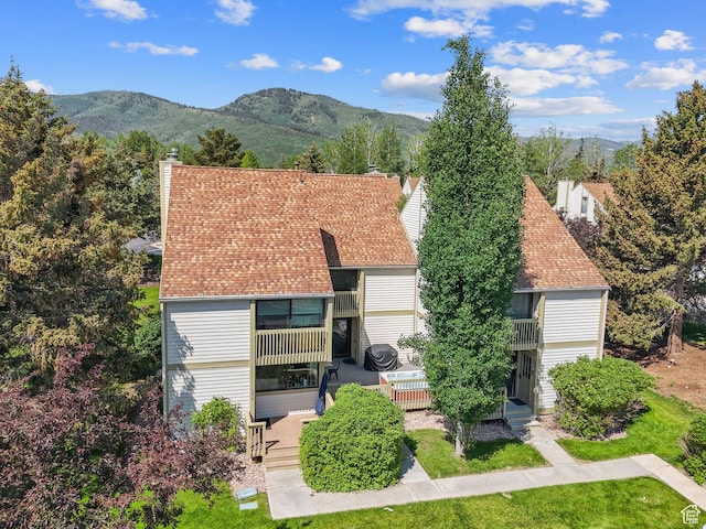 171 Dunlop Ct, Park City, UT 84060 - view of front facade featuring a chimney, a mountain view, a balcony, and a patio area