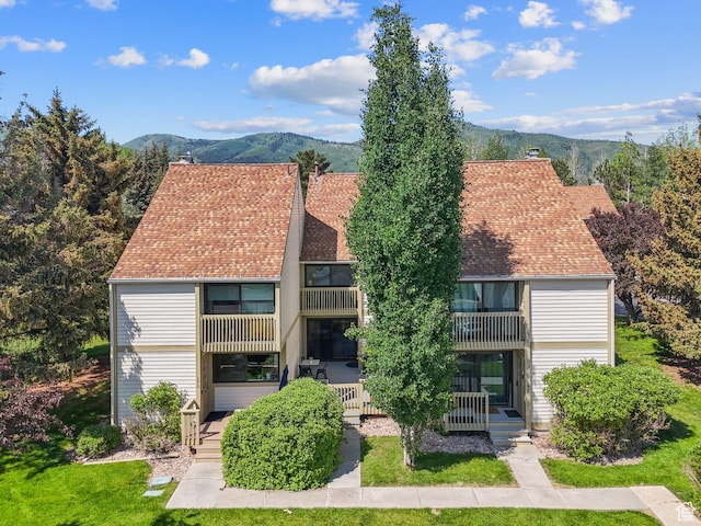 171 Dunlop Ct, Park City, UT 84060 - view of front facade with a balcony, a mountain view, and a front yard
