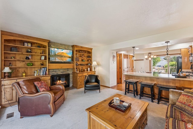 171 Dunlop Ct, Park City, UT 84060 - living room with light colored carpet, a chandelier, and a fireplace