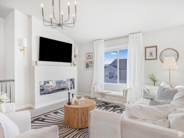 2297 N 250 W, Tooele, UT 84074 - living area featuring a chandelier, a glass covered fireplace, and vaulted ceiling