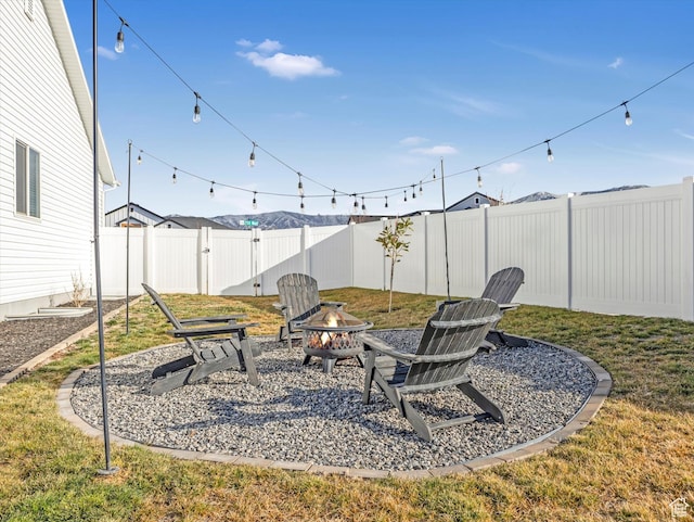 2297 N 250 W, Tooele, UT 84074 - fenced backyard featuring a fire pit