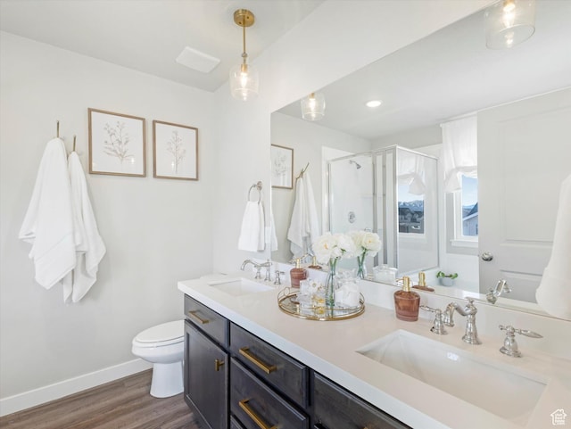 2297 N 250 W, Tooele, UT 84074 - full bathroom with double vanity, a shower stall, and wood finished floors