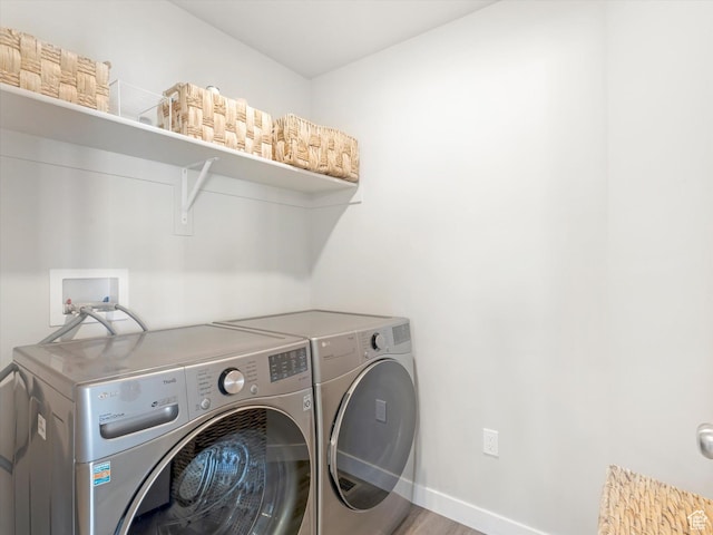 2297 N 250 W, Tooele, UT 84074 - laundry area featuring washing machine and clothes dryer and wood finished floors