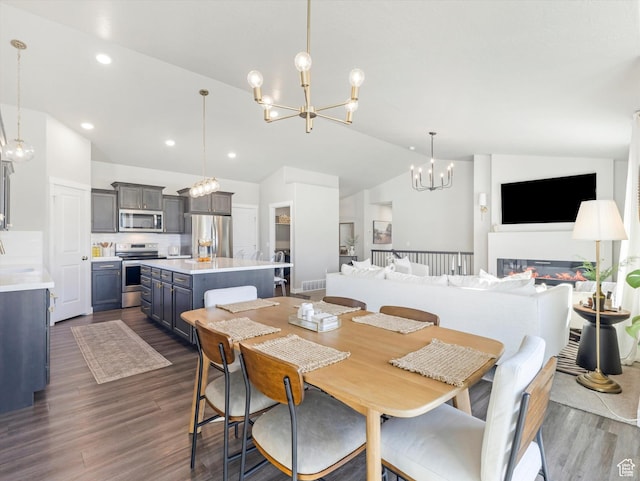 2297 N 250 W, Tooele, UT 84074 - dining space with a chandelier, lofted ceiling, dark wood finished floors, and recessed lighting