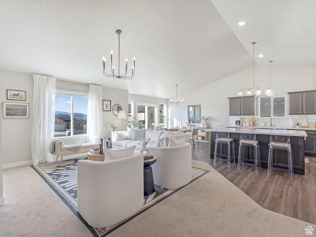 2297 N 250 W, Tooele, UT 84074 - living room featuring a chandelier, vaulted ceiling, wood finished floors, and recessed lighting
