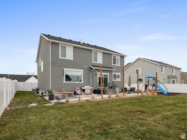 627 S Meade St, Mapleton, UT 84664 - rear view of property with a playground, a patio, a fenced backyard, and stucco siding