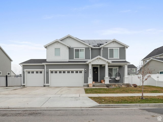 627 S Meade St, Mapleton, UT 84664 - craftsman inspired home with solar panels, covered porch, concrete driveway, and a garage