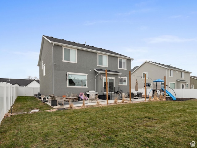 627 S Meade St, Mapleton, UT 84664 - back of property featuring a patio, a playground, a fenced backyard, and stucco siding