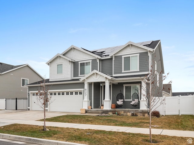 627 S Meade St, Mapleton, UT 84664 - craftsman house with a porch, a garage, solar panels, driveway, and a gate