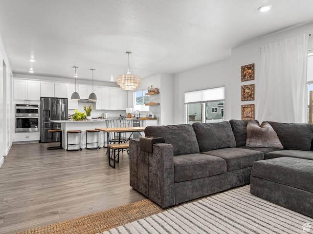 627 S Meade St, Mapleton, UT 84664 - living room featuring light wood-type flooring and recessed lighting