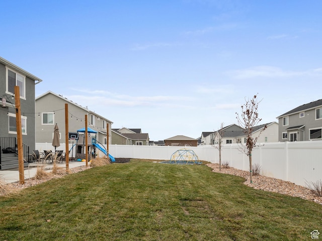 627 S Meade St, Mapleton, UT 84664 - fenced backyard featuring a playground, a residential view, and a patio