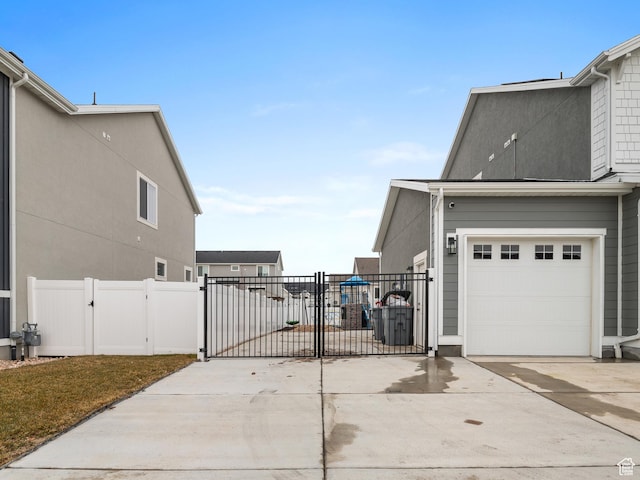 627 S Meade St, Mapleton, UT 84664 - view of property exterior with a gate and concrete driveway