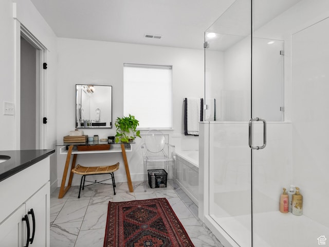 627 S Meade St, Mapleton, UT 84664 - bathroom featuring marble look tiles, a bath, vanity, a shower stall, and recessed lighting