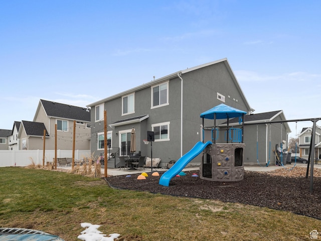 627 S Meade St, Mapleton, UT 84664 - back of property featuring a playground, a residential view, and stucco siding