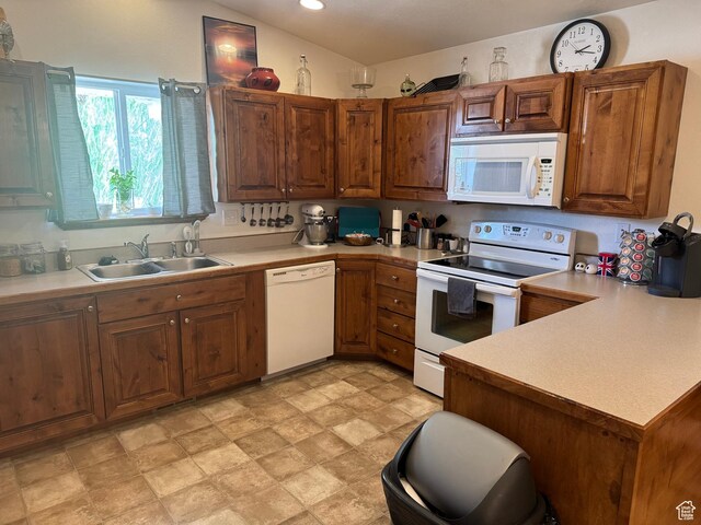 580 E Main St, Myton, UT 84052 - kitchen with white appliances, light countertops, a peninsula, brown cabinets, and recessed lighting