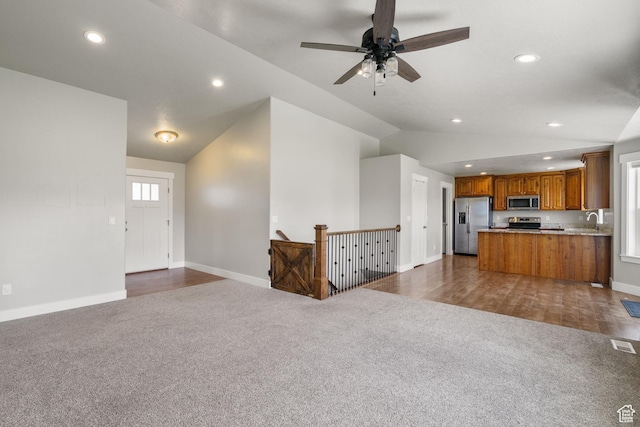 18605 N 6000 W, Riverside, UT 84334 - living area featuring dark colored carpet, lofted ceiling, recessed lighting, and ceiling fan