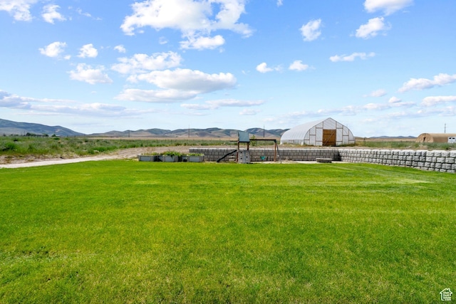 18605 N 6000 W, Riverside, UT 84334 - view of yard featuring an outdoor structure and a mountain view