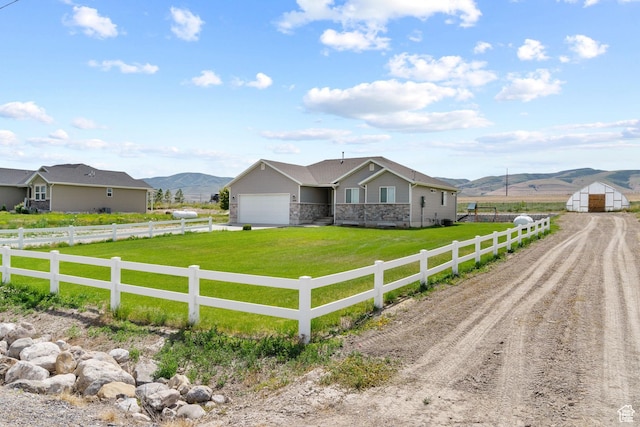18605 N 6000 W, Riverside, UT 84334 - ranch-style home featuring dirt driveway, a view of rural / pastoral area, an attached garage, a mountain view, and stone siding