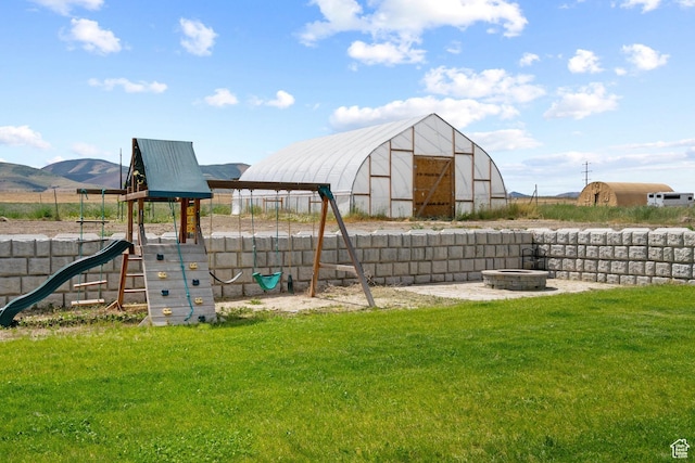 18605 N 6000 W, Riverside, UT 84334 - view of play area with a lawn and a mountain view