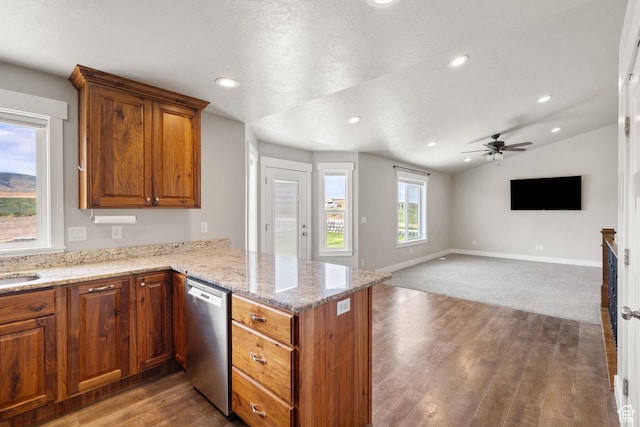 18605 N 6000 W, Riverside, UT 84334 - kitchen featuring stainless steel dishwasher, a peninsula, brown cabinetry, wood finished floors, and lofted ceiling
