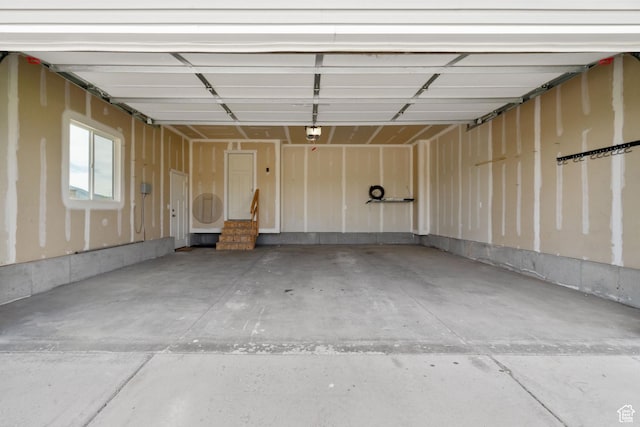 18605 N 6000 W, Riverside, UT 84334 - garage featuring a garage door opener