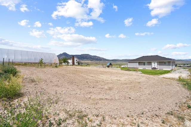 18605 N 6000 W, Riverside, UT 84334 - view of yard with a mountain view and an exterior structure