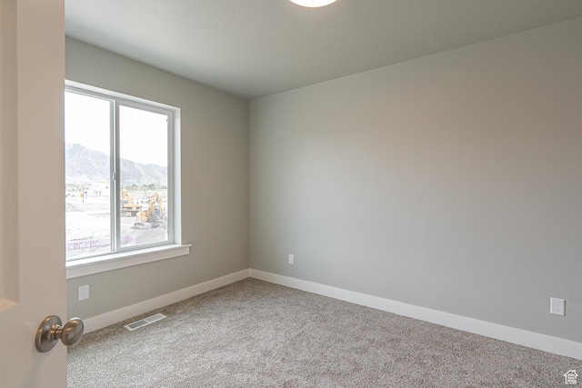 2202 S 1120 W Unit 64, Nibley, UT 84321 - unfurnished room with a mountain view, carpet, and healthy amount of natural light