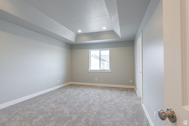 2202 S 1120 W Unit 64, Nibley, UT 84321 - empty room featuring a textured ceiling, a raised ceiling, carpet, and recessed lighting