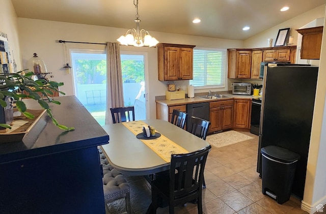 1751 E Canary Way, Eagle Mountain, UT 84005 - kitchen with brown cabinets, a chandelier, appliances with stainless steel finishes, recessed lighting, and pendant lighting