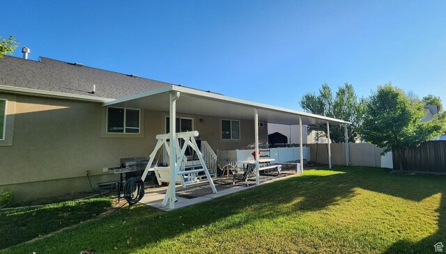 1751 E Canary Way, Eagle Mountain, UT 84005 - rear view of property with stucco siding and a patio area