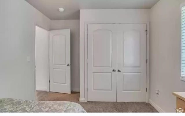 1751 E Canary Way, Eagle Mountain, UT 84005 - unfurnished bedroom featuring a closet and carpet