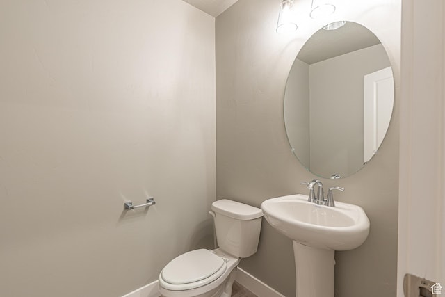 2206 S 1120 W Unit 65, Nibley, UT 84321 - bathroom featuring baseboards and toilet
