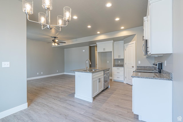 2206 S 1120 W Unit 65, Nibley, UT 84321 - kitchen with stainless steel appliances, a chandelier, ceiling fan, recessed lighting, and dark stone countertops